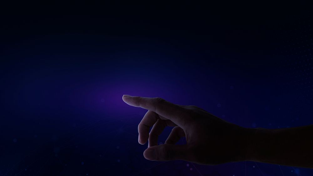 Finger touching an interactive dark blue presentation screen