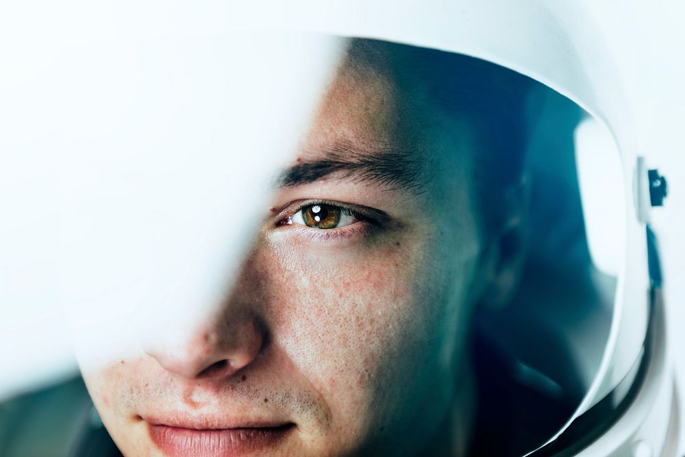 Male astronaut with glass helmet