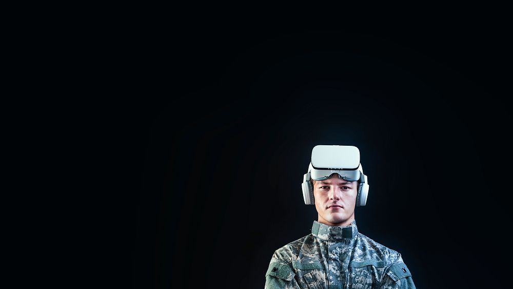 Soldier in VR headset for simulation training military technology black background