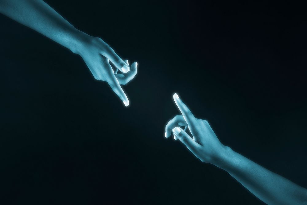 Human hands reaching for each other digital connection