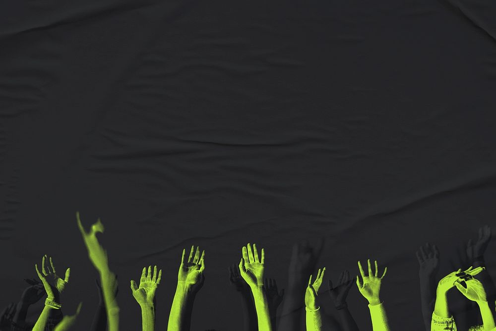 Psd arms neon green raising up on black textured background