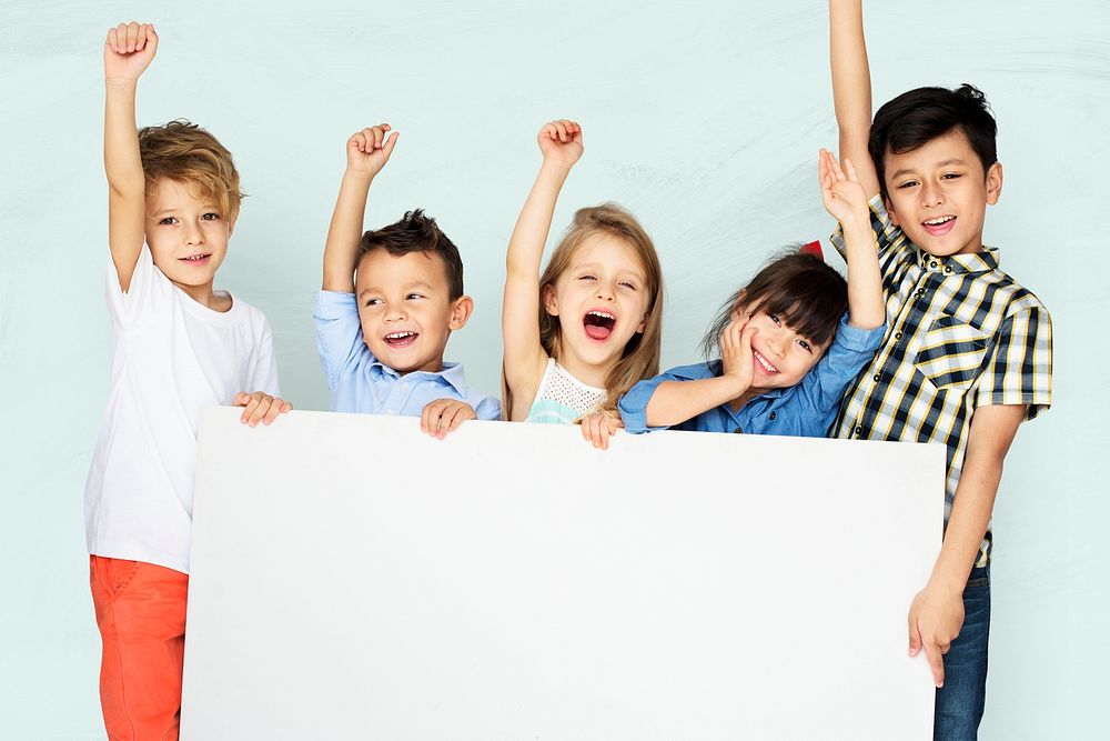 Kids raising arms psd cheering with white mockup board