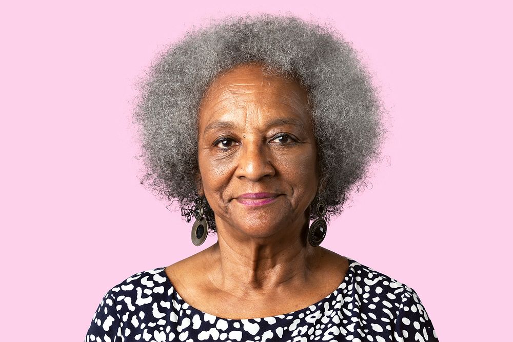 Elderly woman smiling face closeup portrait on pink background