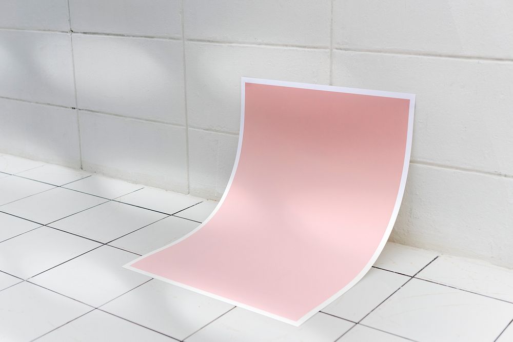 Pink poster mockup psd on a ceramic tile floor