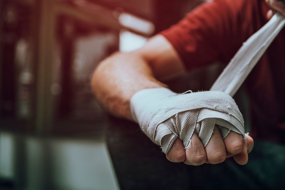 Man wrapping his hand, ready for boxing 