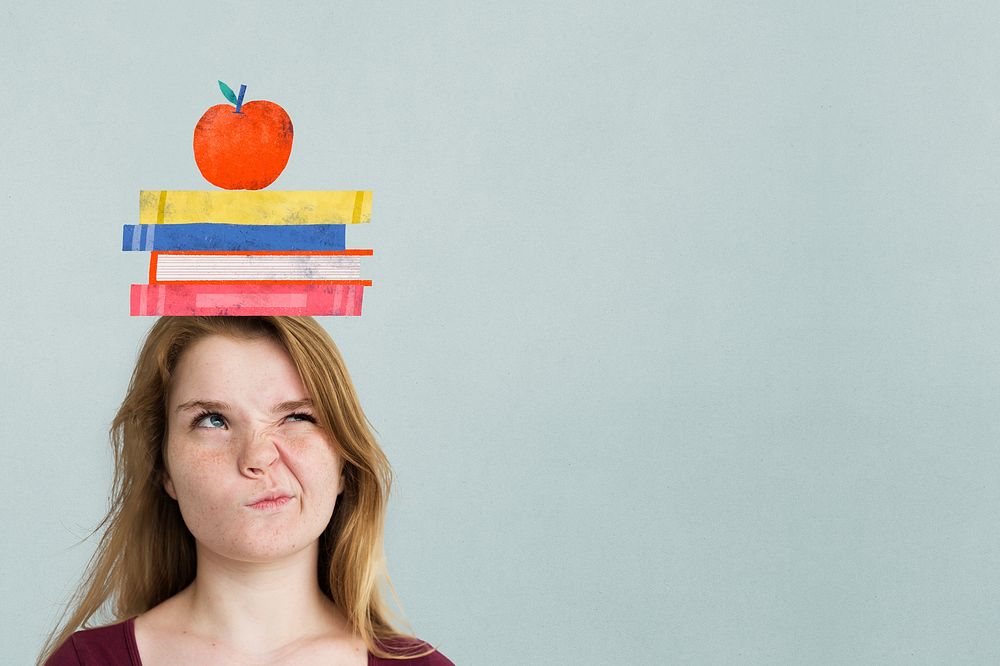 Student with book stack on her head
