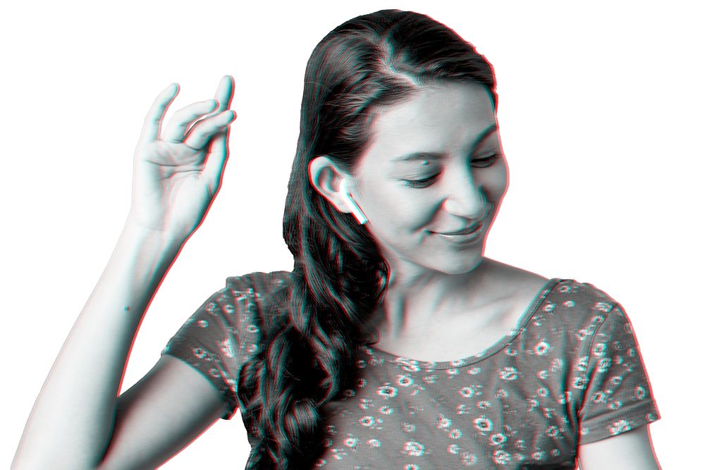 Woman listening to music psd through wireless earphones in double color exposure effect