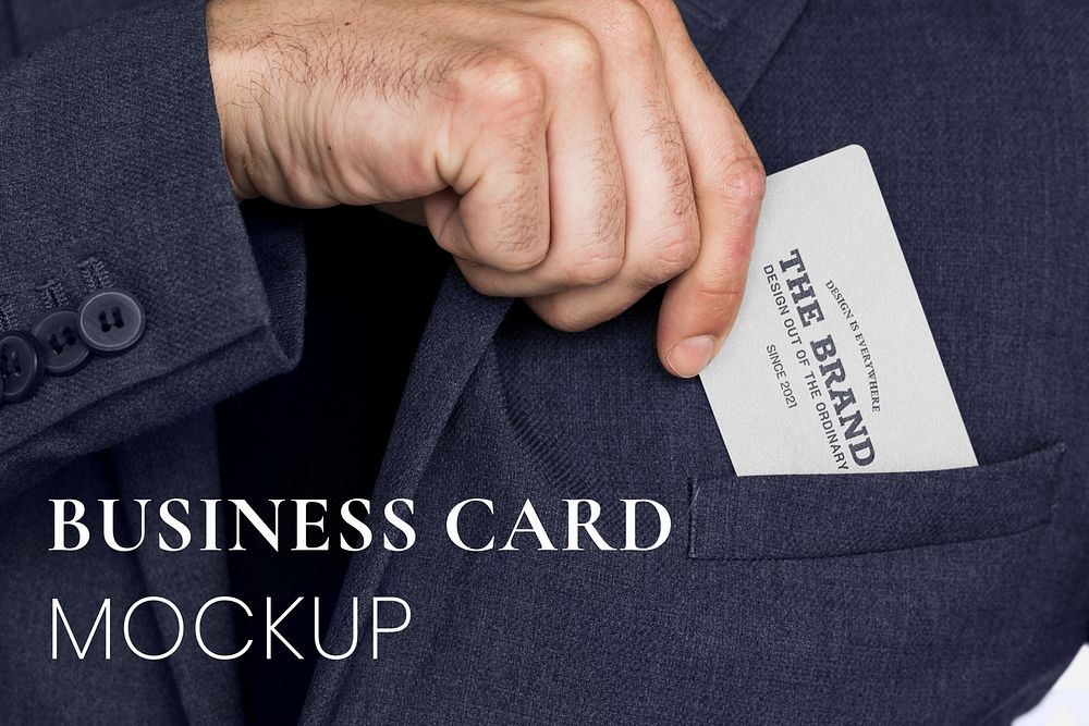 Business card mockup in a business man's hand psd