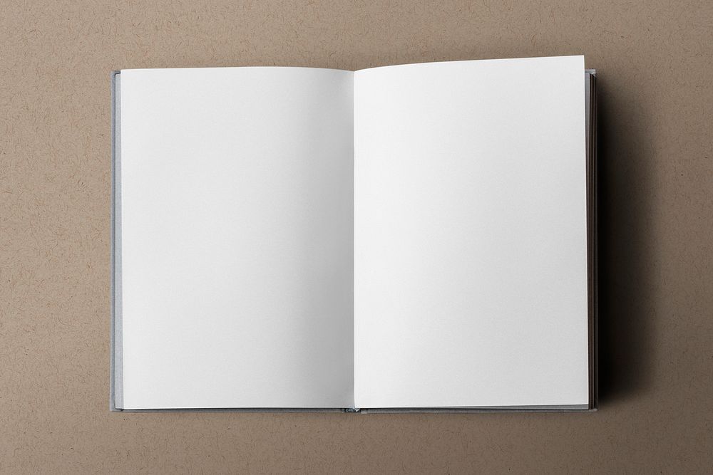 Empty book pages on brown background