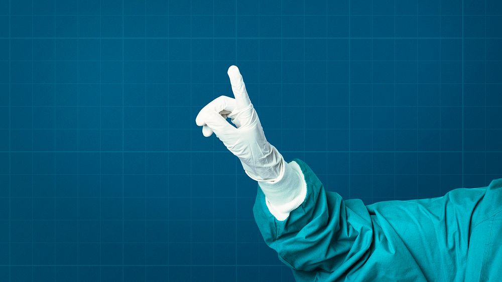 Hand in medical glove showing index finger medical technology