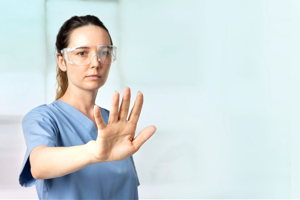 Female doctor  with smart glasses touching virtual screen medical technology