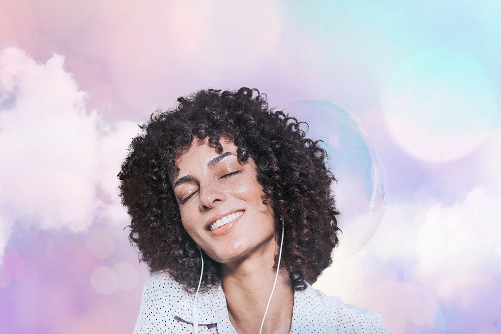 Happy woman with curly hair wearing earphones remixed media with pastel bokeh lights effect