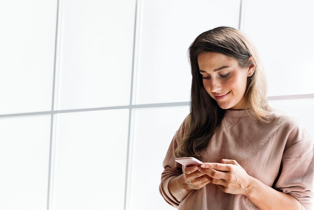Woman holding smartphone background psd in the office