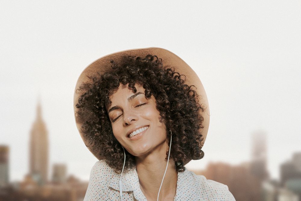 Woman wearing earphones background psd with city view remixed media