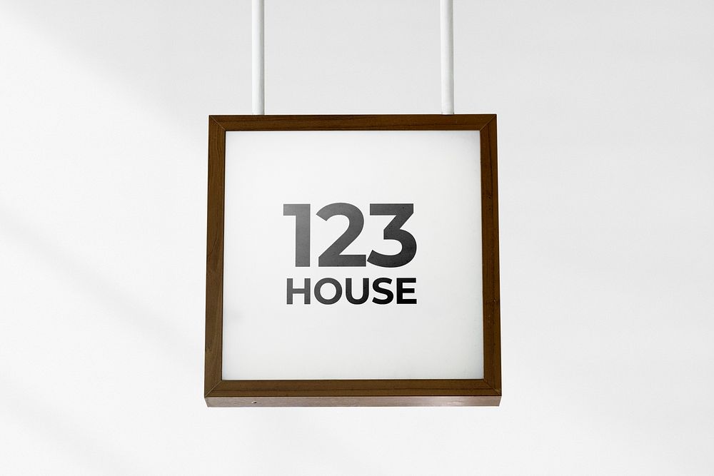 Brown framed sign mockup psd hanging from the ceiling