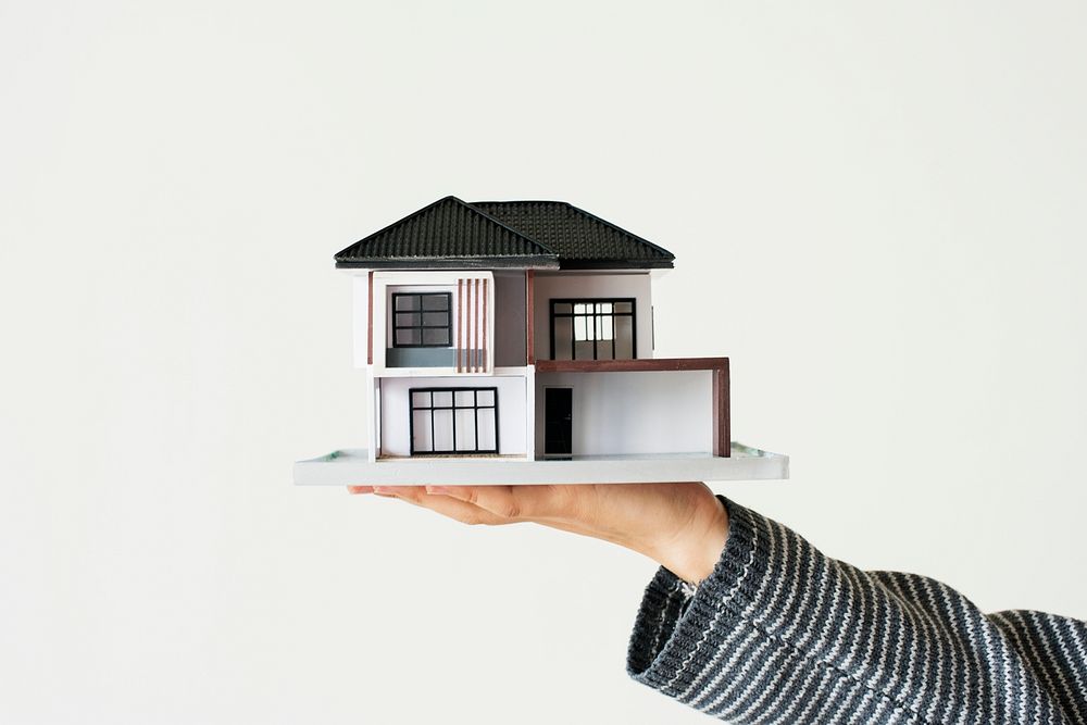 Hand presenting model house psd for home loan campaign