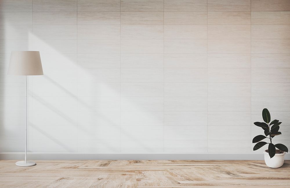 Lamp and a plant in an empty room wall mockup