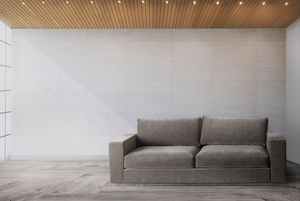 Gray couch against a wall Premium PSD Mockup rawpixel