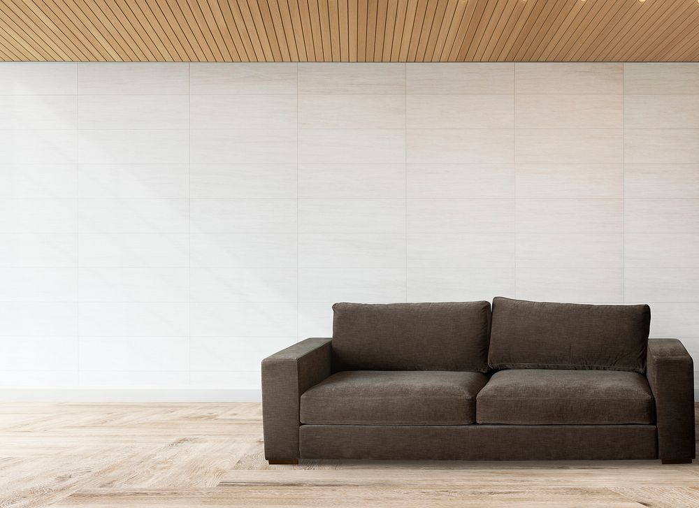 Brown couch against a white wall mockup
