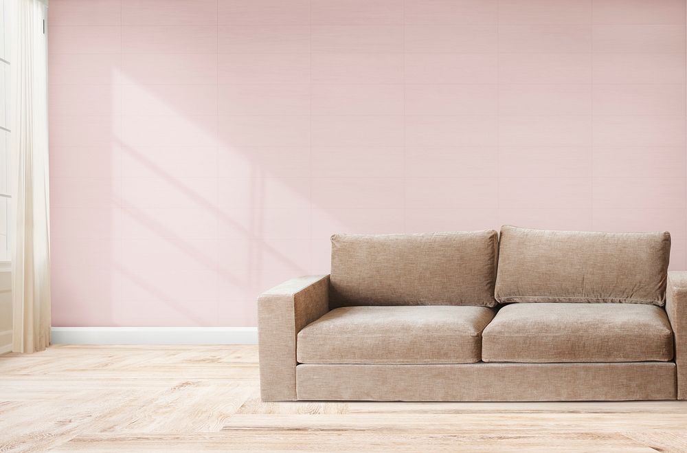 Brown couch against a pink wall mockup