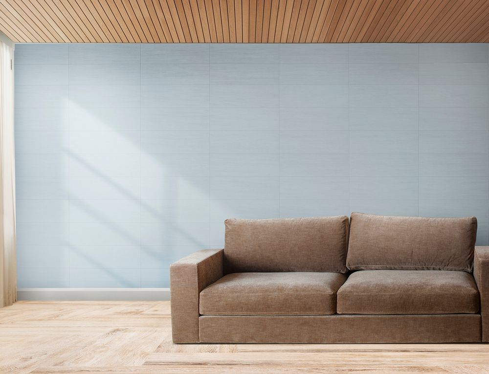 Brown couch against a gray wall mockup