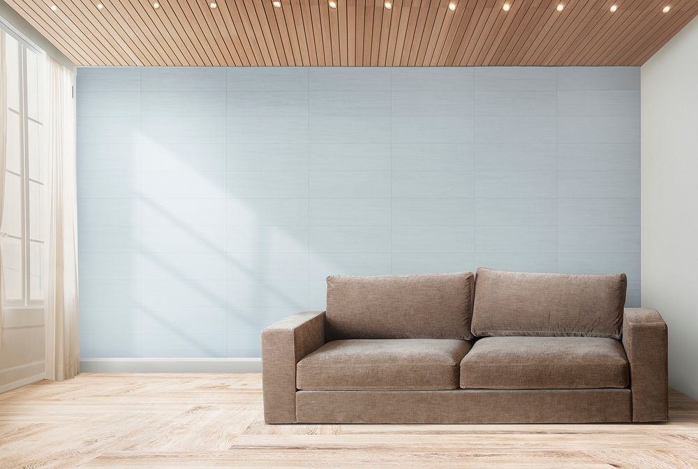 Brown couch against a gray wall mockup