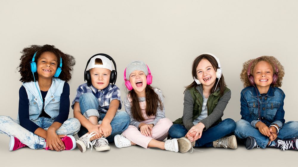 Group of Children Studio Smiling Wearing Headphones and Winter Clothes