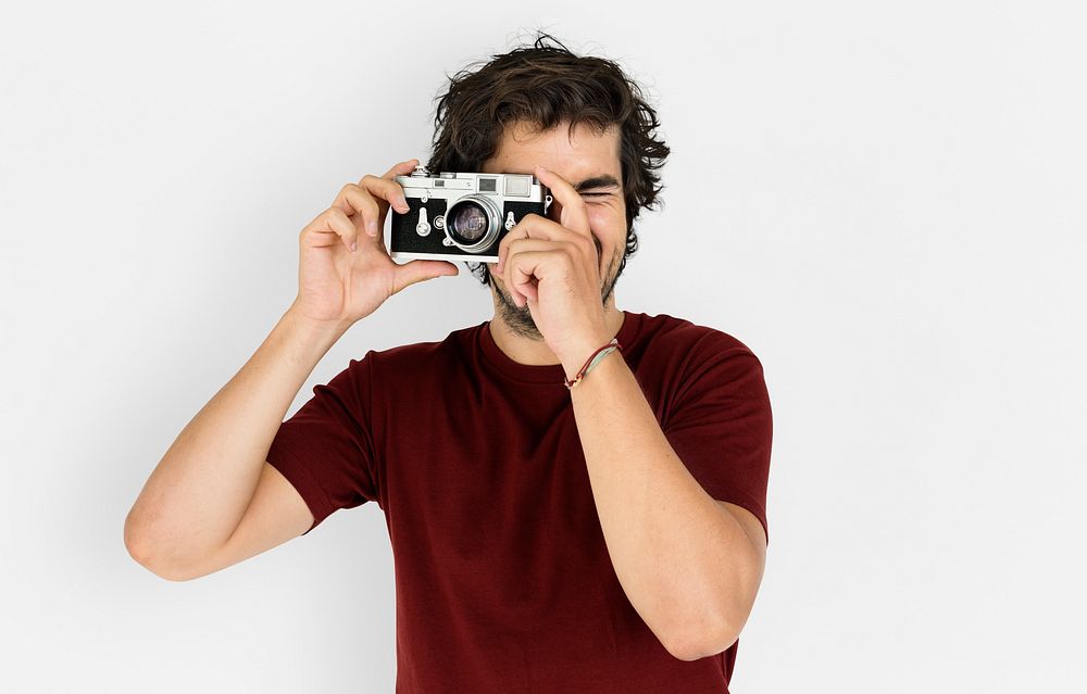 Man taking a photo with a vintage camera