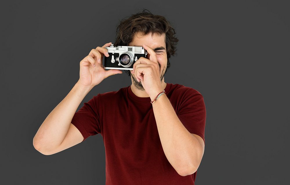 Portrait of a guy taking photos with a camera