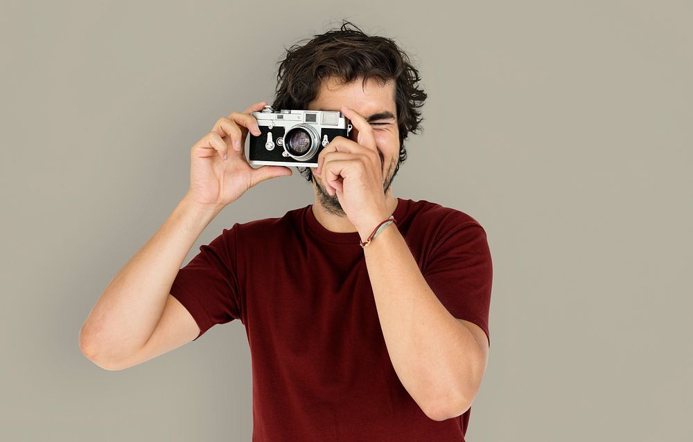 Portrait of a guy taking photos with a camera