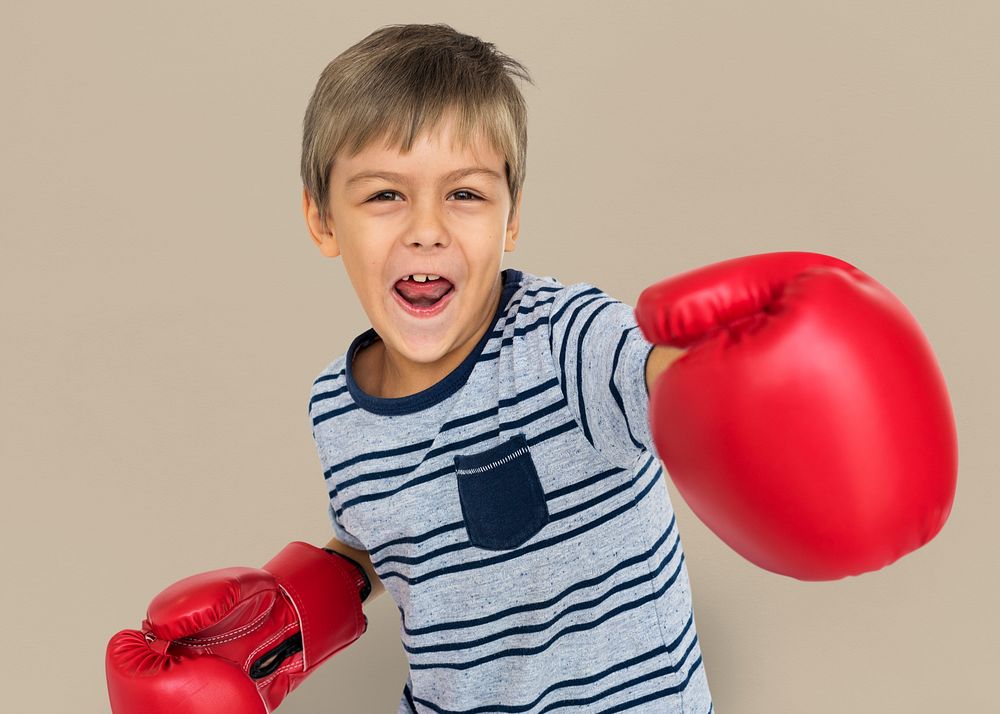 Portrait of a boy wearing boxing gloves