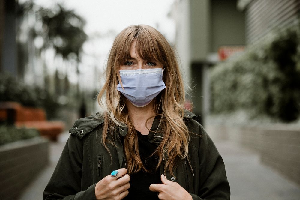 Woman wearing a face mask in public during coronavirus pandemic