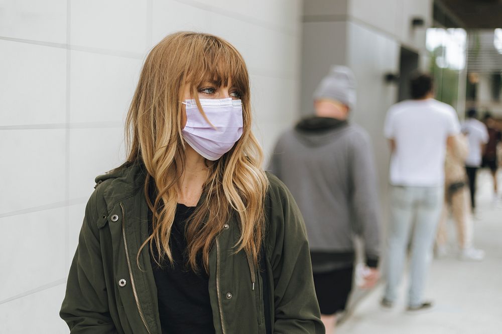Woman with a face mask in public during coronavirus outbreak