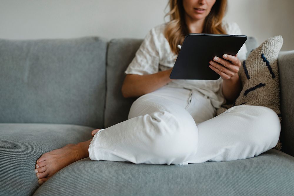 Woman in pyjamas working at home during coronavirus outbreak 