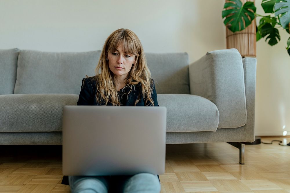 Woman using a laptop while working at home during the coronavirus outbreak