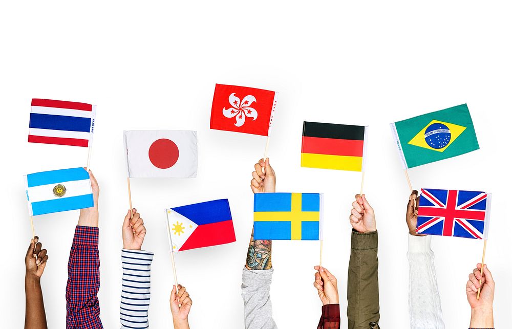 Hands holding international flags