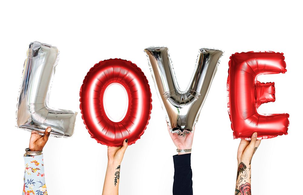 Diverse hands holding love balloon