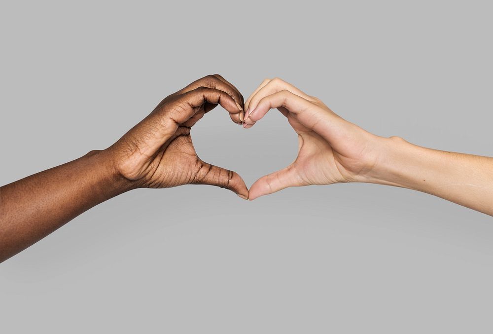 Diverse hands gestured in heart-shape