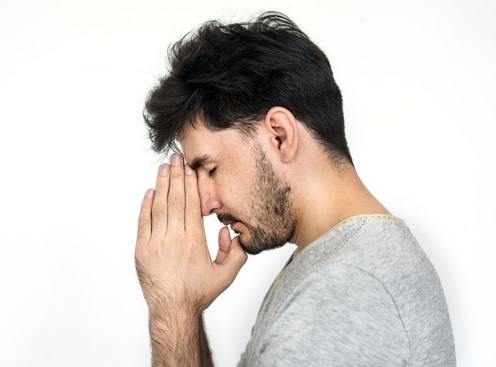Portrait of a man praying