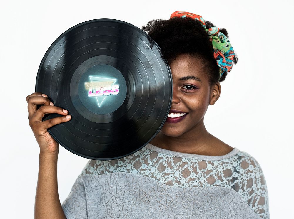 Portrait of an African woman holding a Phonograph record
