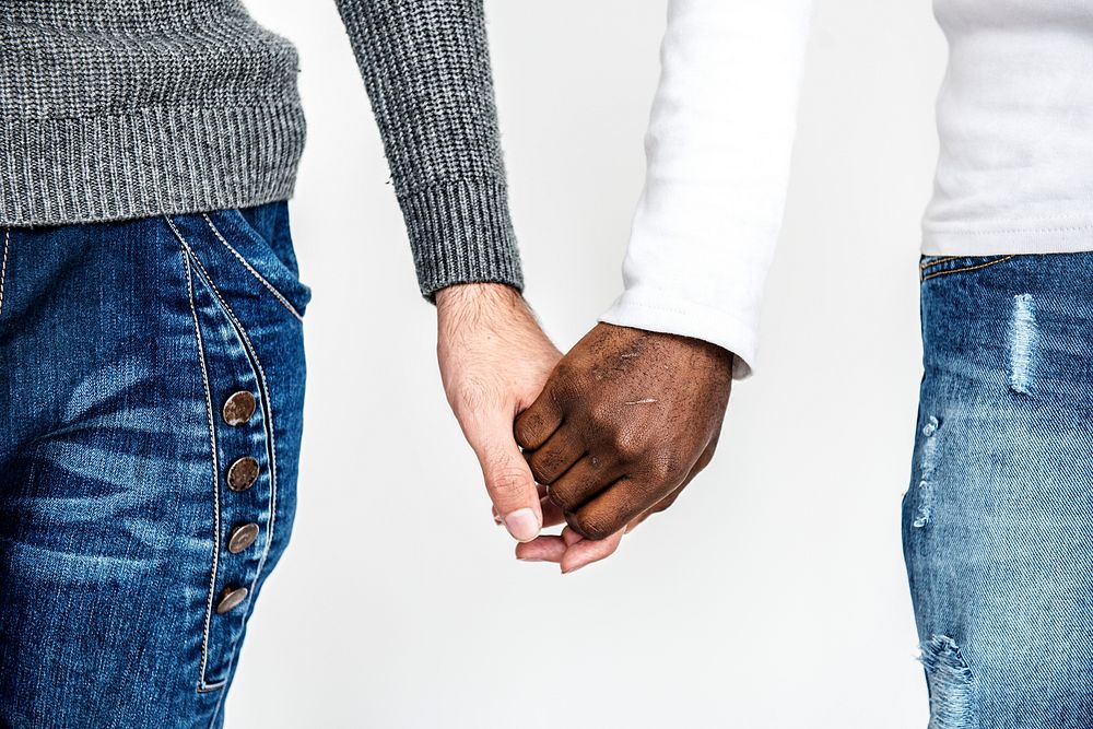 Close up view of a couple holding hands
