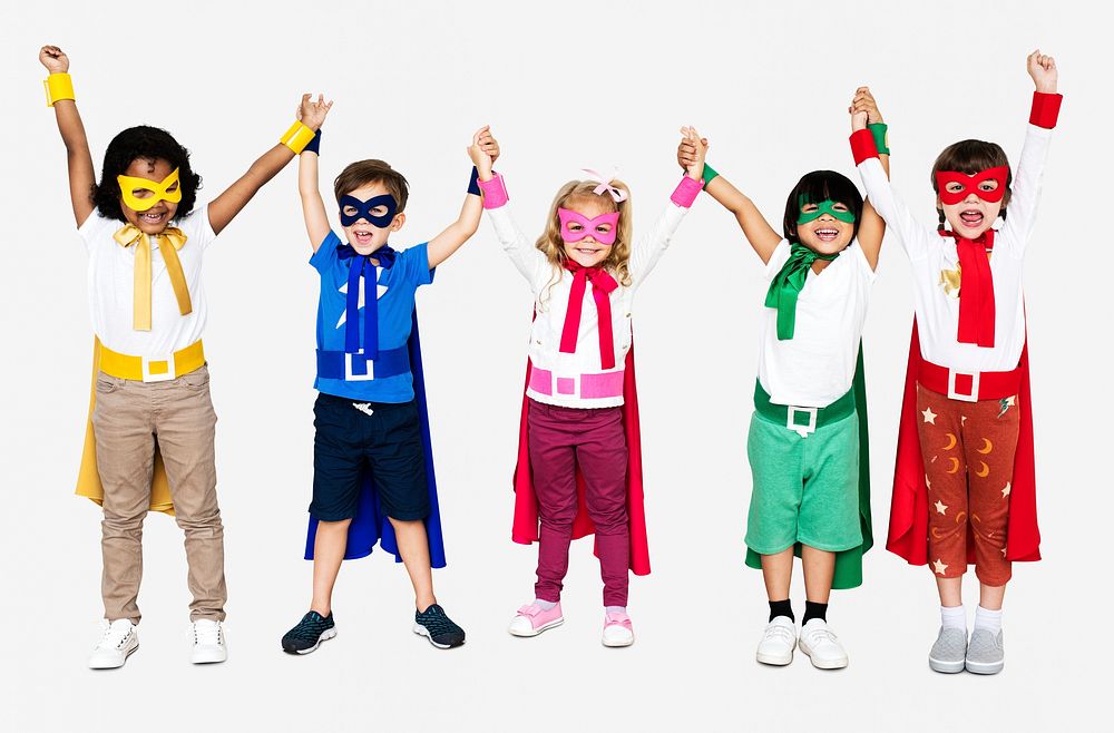 Cheerful kids wearing superhero costumes and holding hands