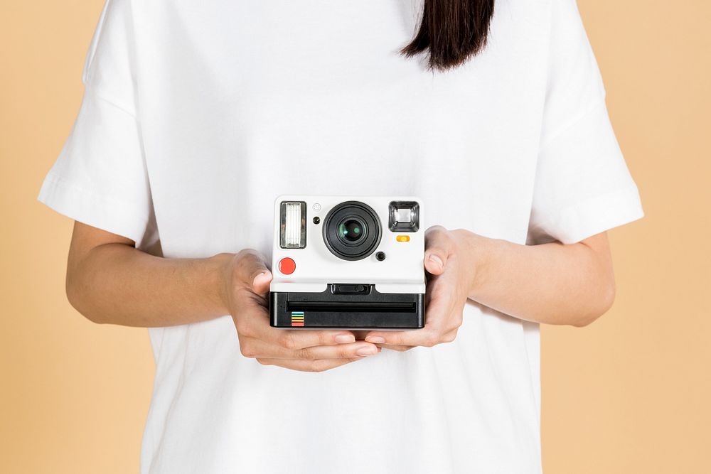 Woman with an instant film camera