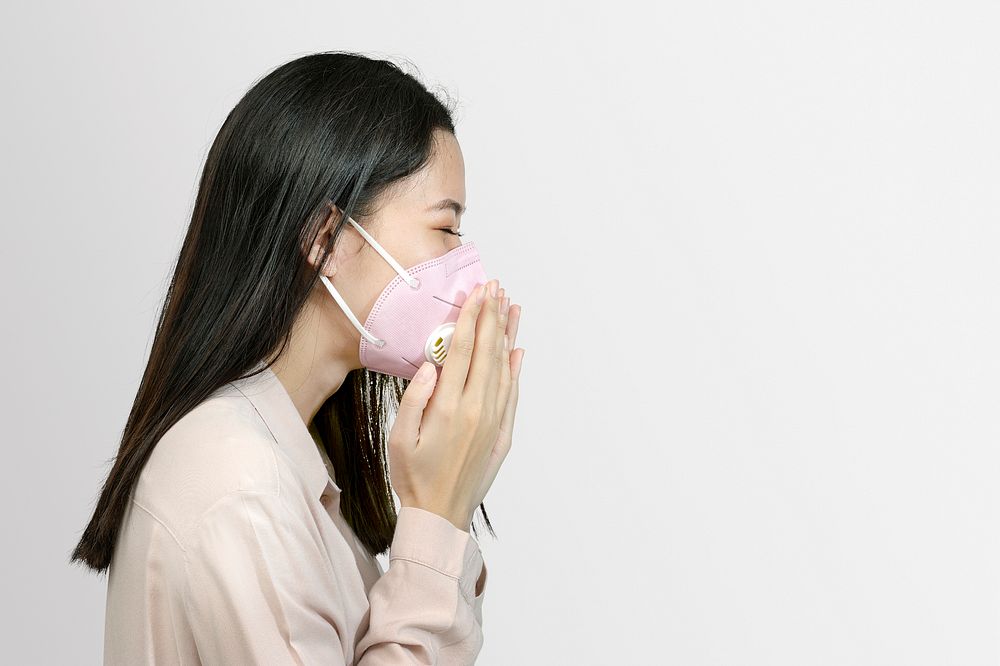 Asian woman wearing a mask and coughing mockup
