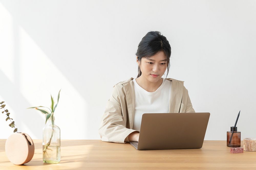 Asian woman at home using a laptop 
