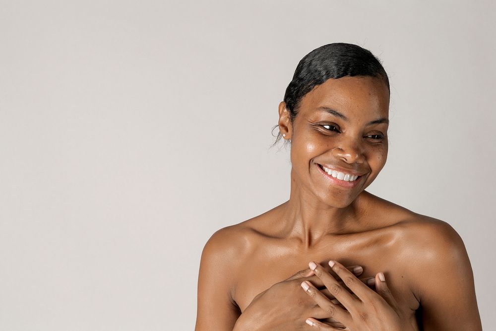 Cheerful bare chested black woman portrait