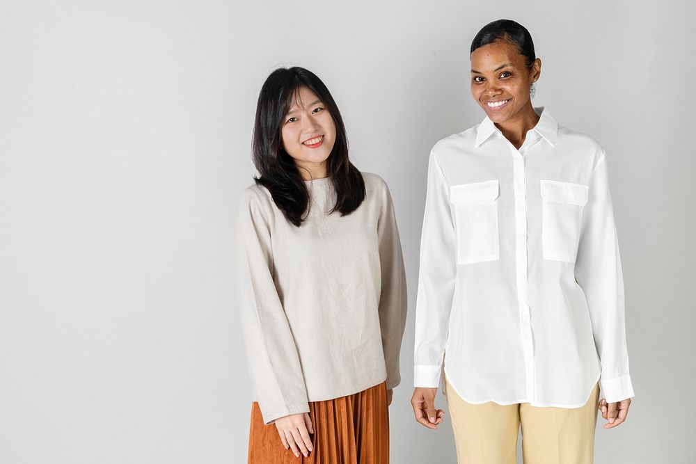 Asian and African woman in minimal style clothing