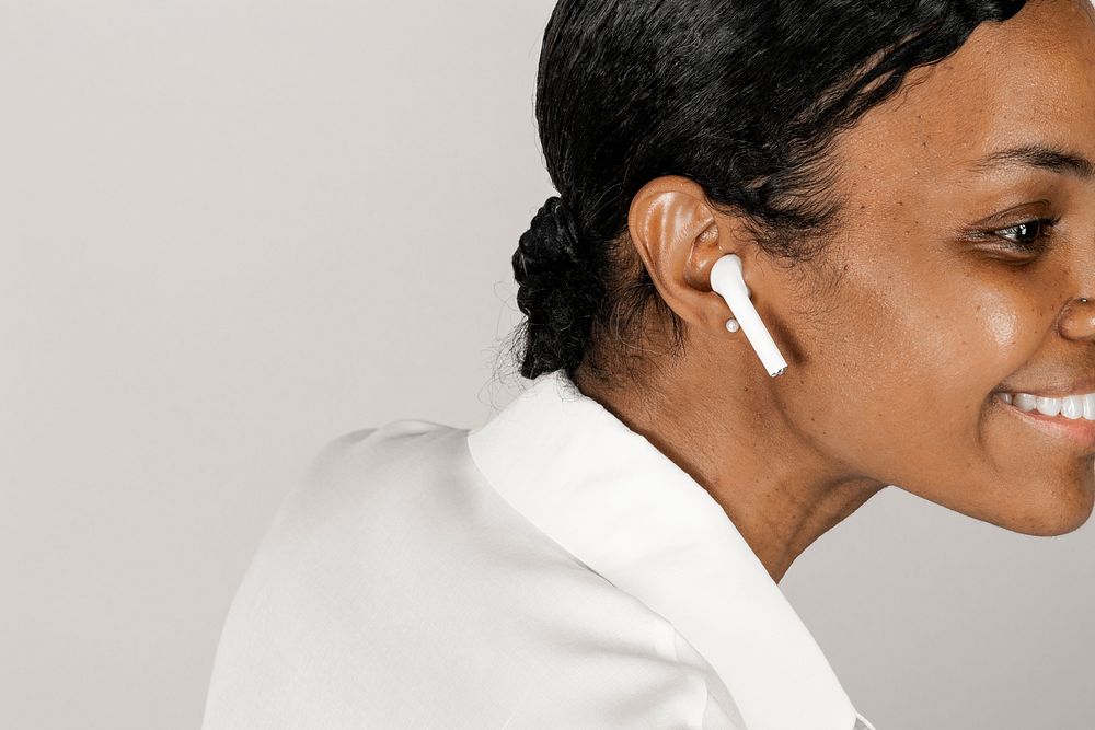 Black woman listening to music