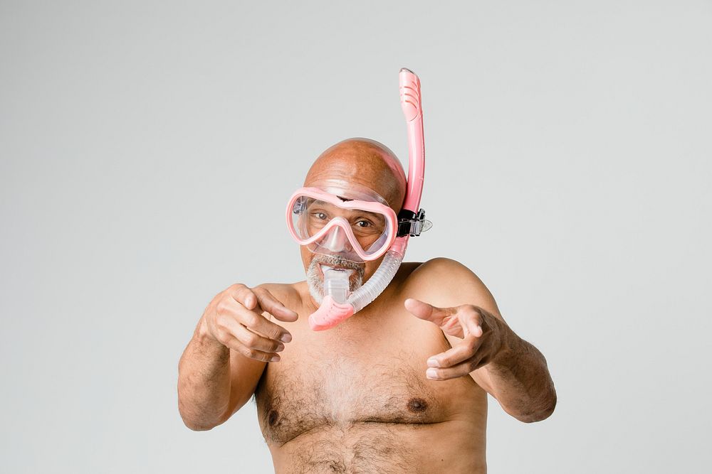 Senior man wearing a snorkel scuba mask