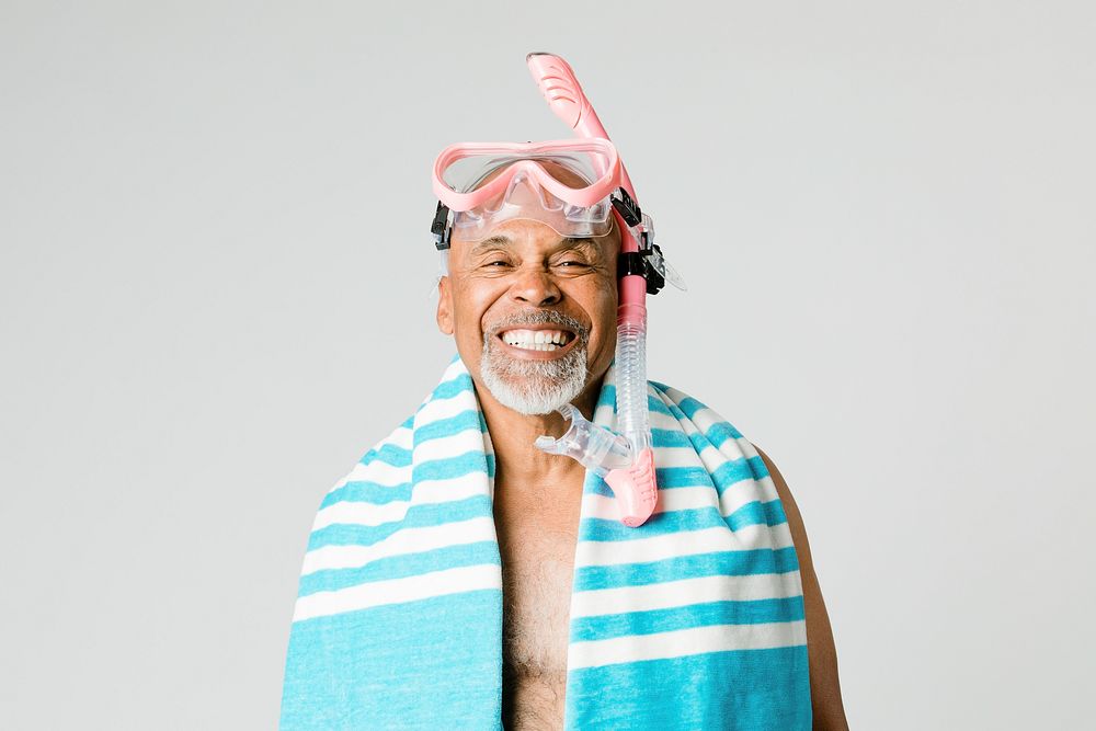 Senior man wearing a snorkel scuba mask